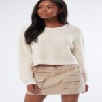Cozy Sophistication A Cropped Knit Sweater for Effortless Style. Cozy Sophistication A Cropped Knit Sweater for Effortless Style.