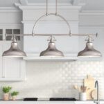 Elegant 3-Light Pendant Illuminates Cozy Kitchen Island.