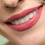 Woman with red lipstick smiling