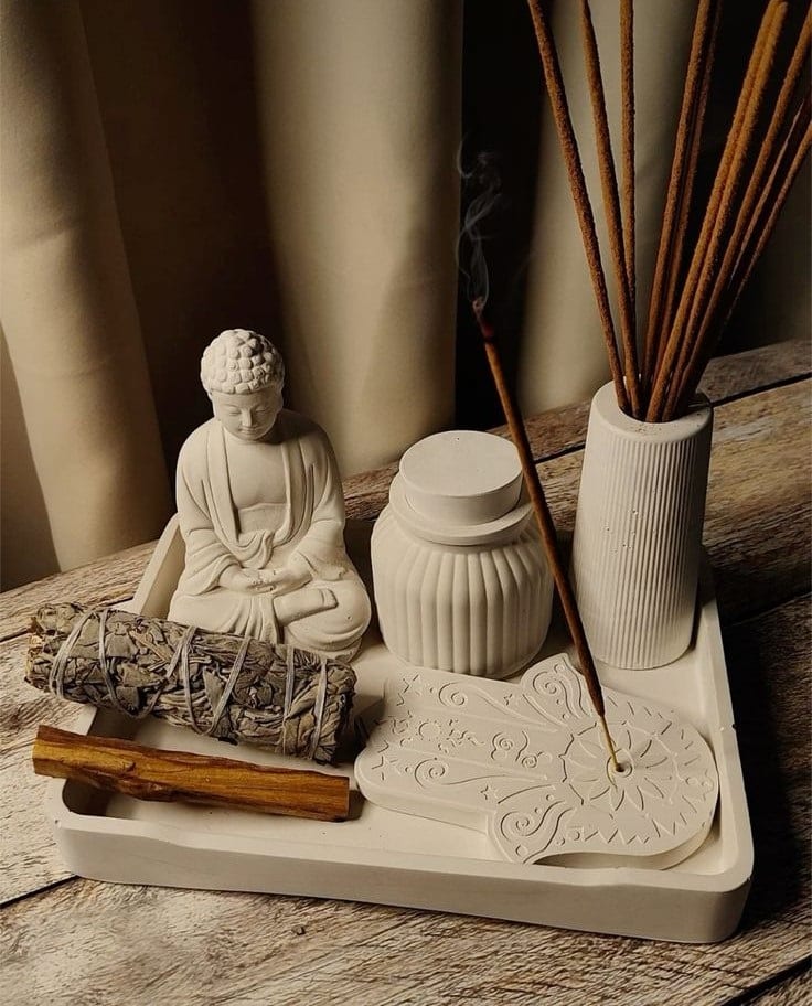 Transform Your Practice with Powerful Yoga Techniques and Insights. 9 Tray with incense and Buddha statue, image from Pinterest