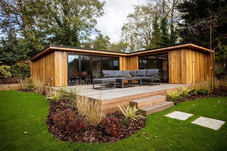 Discover the Incredible Benefits of Modular Homes Today. 4 Modular house with wooden cladding and outdoor sofas