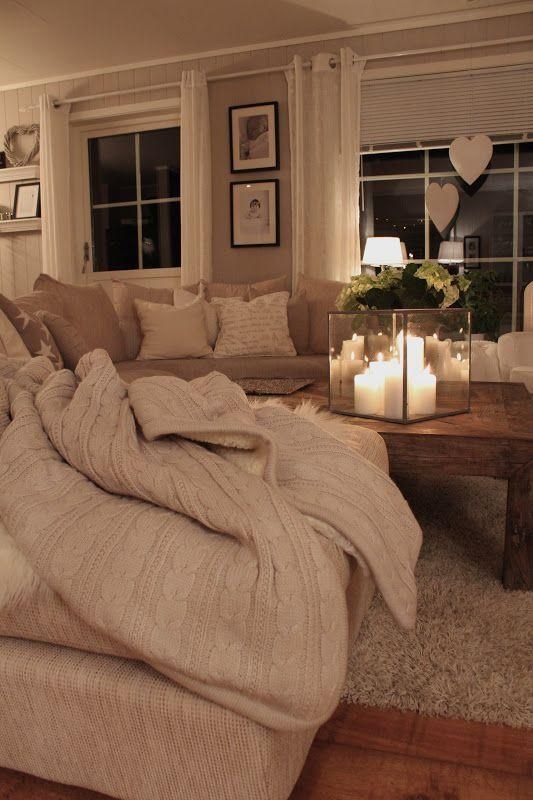 Transform Your Home into a Cozy Winter Retreat. 7 Living room in neutral colors with sofa and blanket.
