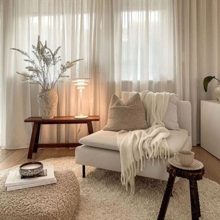 Transform Your Home into a Cozy Winter Retreat. 2 Living room in neutral colors with blanket on the sofa.