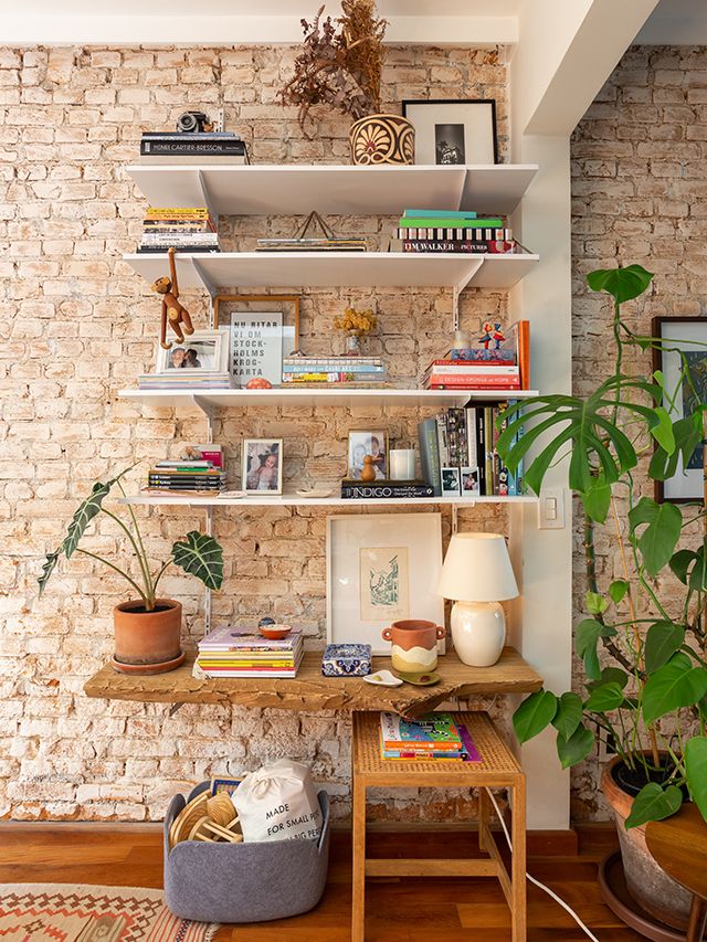 Transform Your Space with Meaningful Emotional Decoration Ideas. 1 Space with bricks and a shelf full of special objects