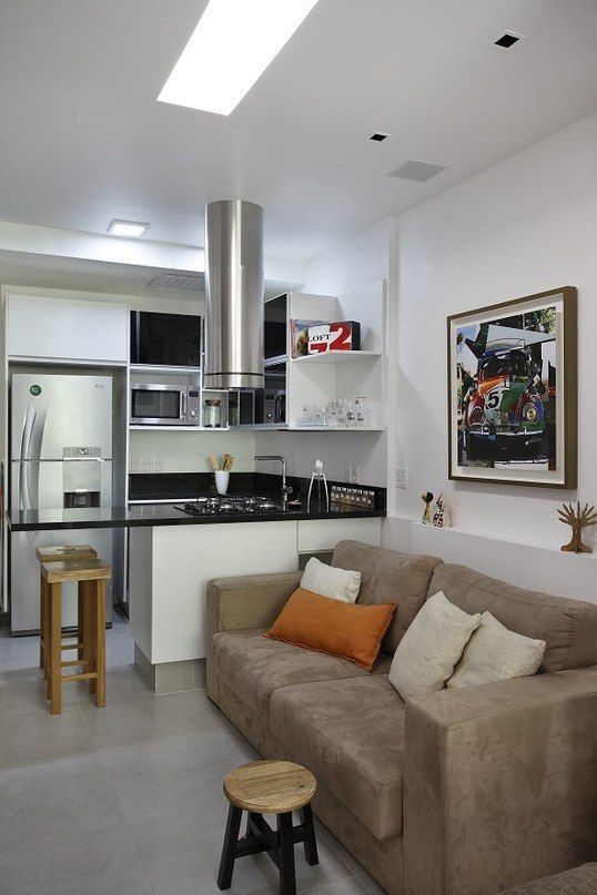 Kitchen in light tones and light brown sofa