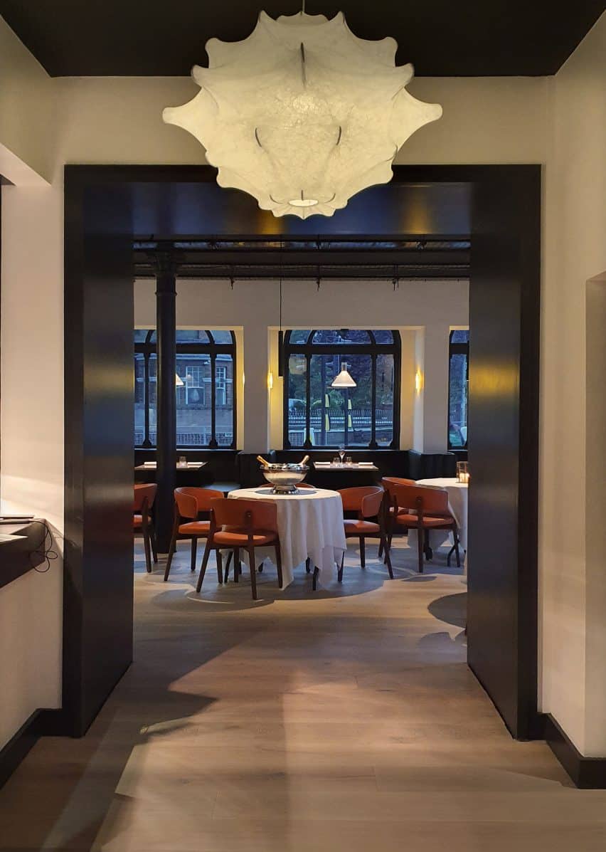 Monochrome Redesign of Etch Restaurant by Akram Fahmi 5 Stretched lampshades recall the nearby coastal landscape