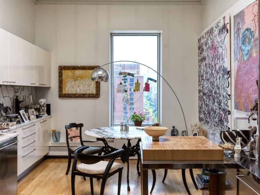 Eccentric Redesign of Historic Tribeca Penthouse by Crina Arghirescu Rogard 5 The eclectic mix of furniture and artwork in the kitchen, reflecting the homeowner's family heritage.