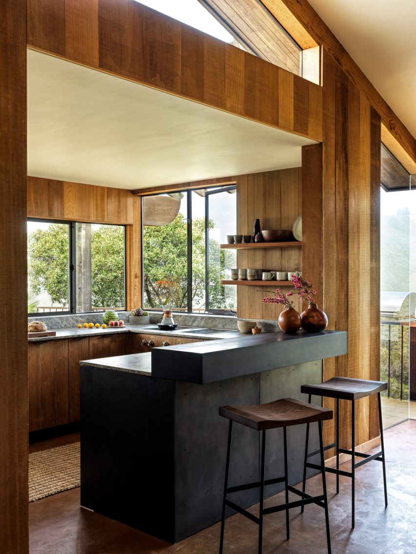 Updated compact kitchen featuring redwood panelling and custom upgrades.