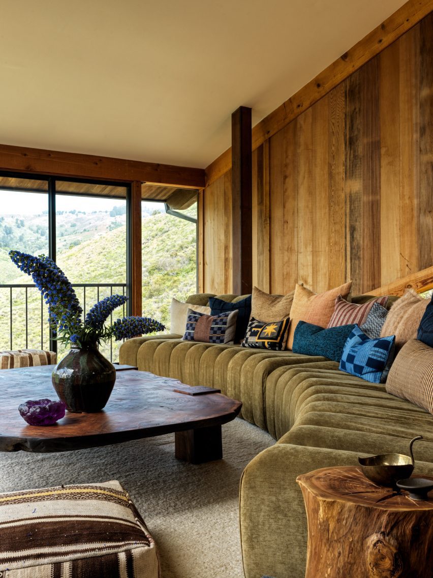 Living room showcasing custom furniture, including a curved sofa that highlights the stunning canyon views.