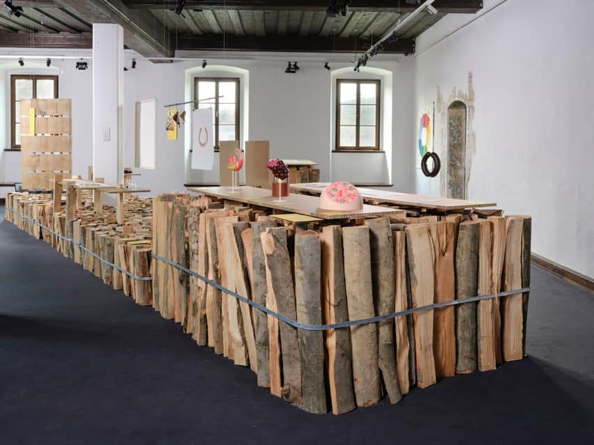 Medprostor Stacks Firewood for Ljubljana Design Biennial 3 Bundles of firewood used as exhibition display podiums.