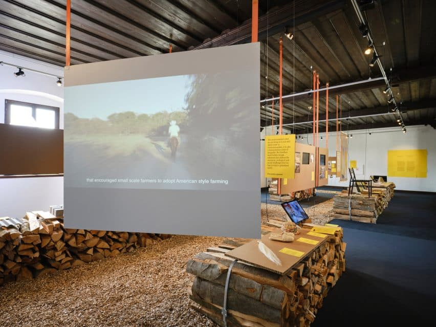 Medprostor Stacks Firewood for Ljubljana Design Biennial 5 Photos and texts mounted onto honeycomb cardboard placed on top of logs.