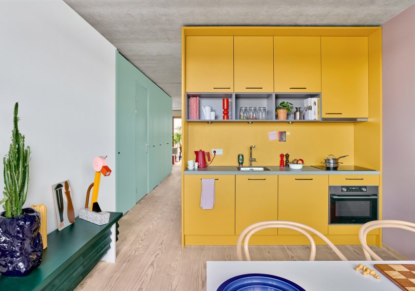 Shift Architecture Urbanism in The Netherlands uses bright colors in a modular kitchen design to create a playful atmosphere.