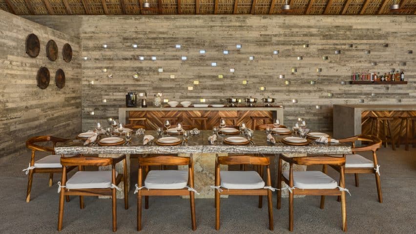 Image of Casa Cova, a holiday home in Oaxaca designed with concrete, local parota wood, and a thatched roof made from dried palm leaves.