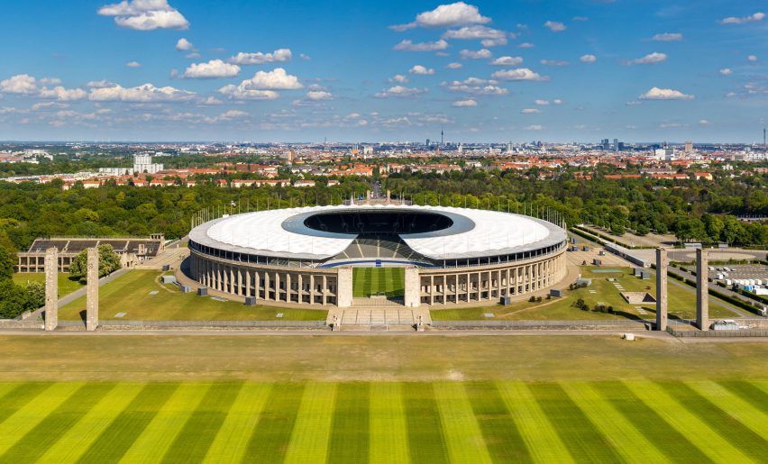 Westfalenstadion presenting its connected grandstands under high-tech structural masts.