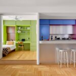 A vibrant New York apartment renovation featuring bright hues and tailored interiors.