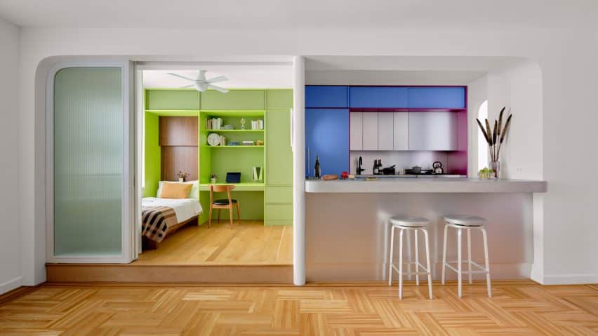 A vibrant New York apartment renovation featuring bright hues and tailored interiors.