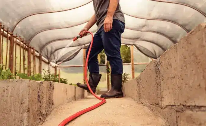 Choose a hose that is long enough for your garden, made of durable material, and thick enough to allow good water flow