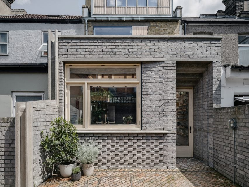 The ground floor includes a full-width brick extension that houses a bright, spacious kitchen area, enhancing flow.