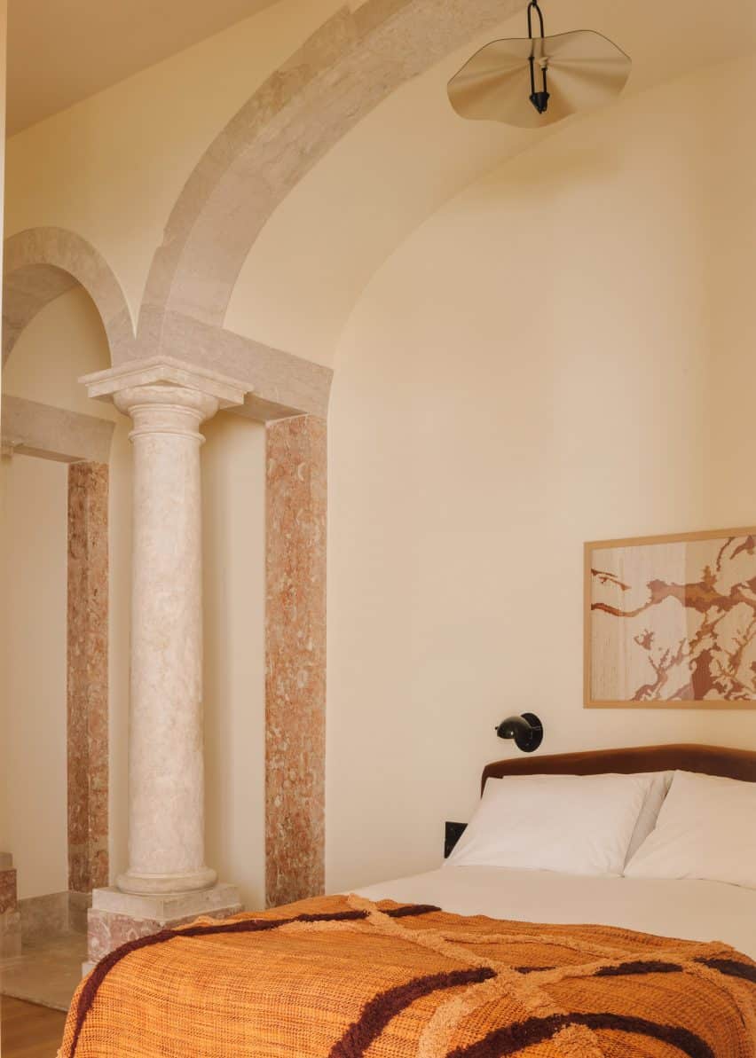 Transformation of a Historic Convent into the Locke de Santa Joana Hotel in Lisbon 3 Bedroom with archways and pillars.