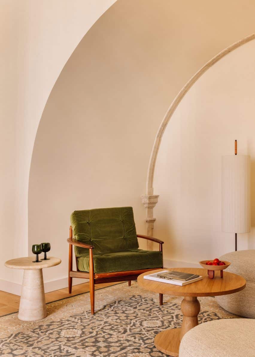 Transformation of a Historic Convent into the Locke de Santa Joana Hotel in Lisbon 4 Green chair in minimal interior by Post Company.