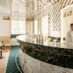 A visually striking image showcasing the Cravan cocktail bar with contemporary design elements.