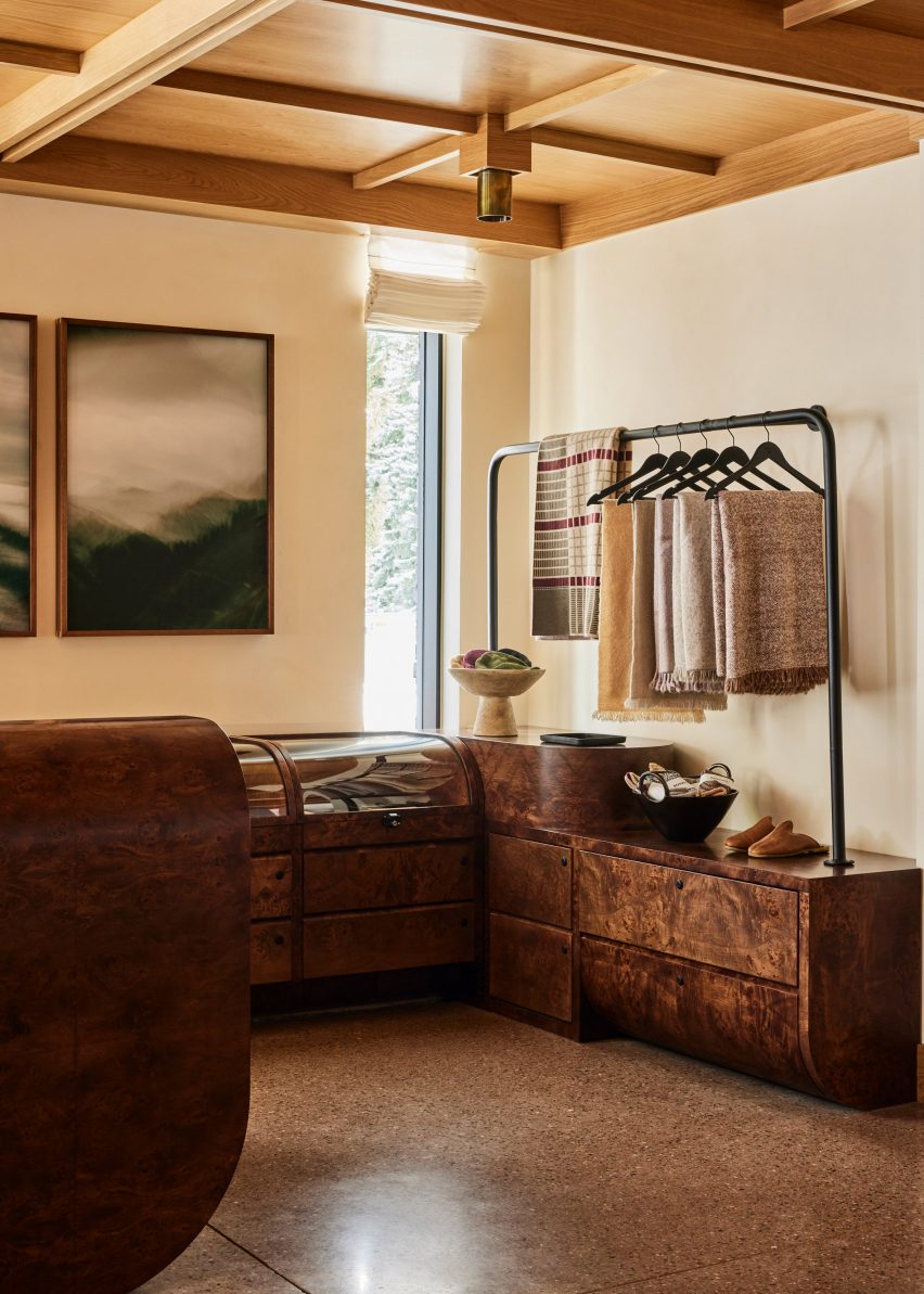 Burl wood counters in the retail space presenting goods with a curated aesthetic.