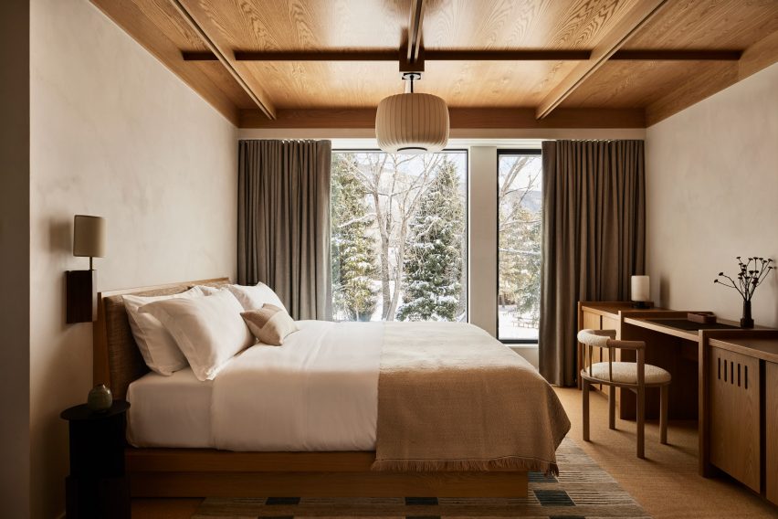 Guest rooms continuing the neutral decor palette with a minimalistic approach.