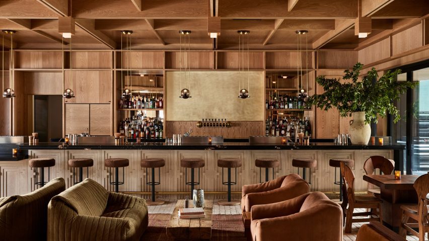 A warm, wood-filled design for the Mollie Aspen hotel, promoting a serene atmosphere.