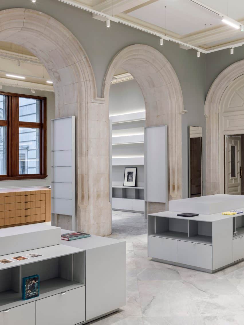 Interior view featuring arched display stands, demonstrating a modern design approach.