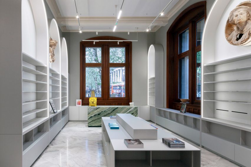 Overview of the retail space highlighting the impressive height and design integration.