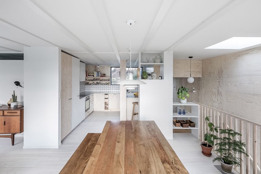 Segal House in London utilizes extensive plywood to avoid specialist trades, reflecting a cost-effective renovation strategy.