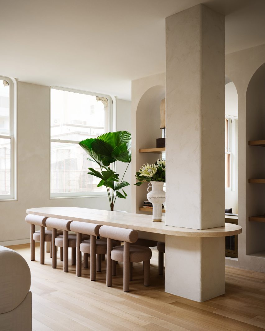 Timothy Godbold Transforms Tribeca Loft with Modernist Design Elements 3 Dining table anchored to a structural column