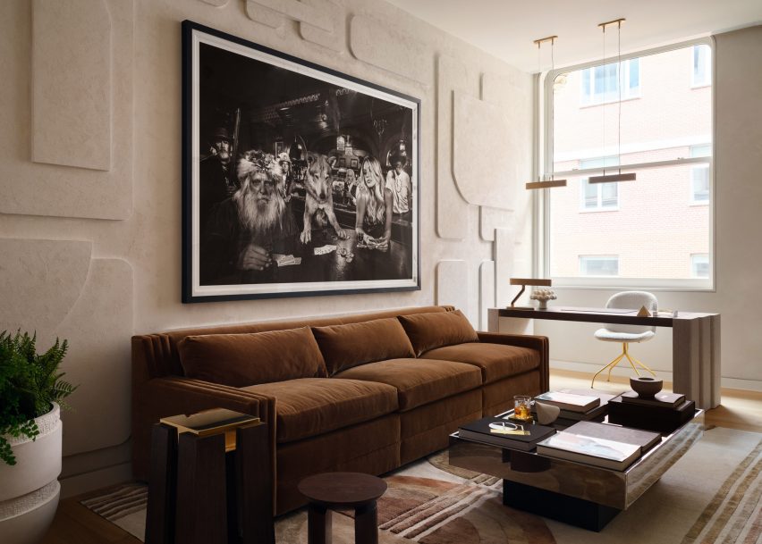 Timothy Godbold Transforms Tribeca Loft with Modernist Design Elements 5 Flexible office and bar space with a brown sofa