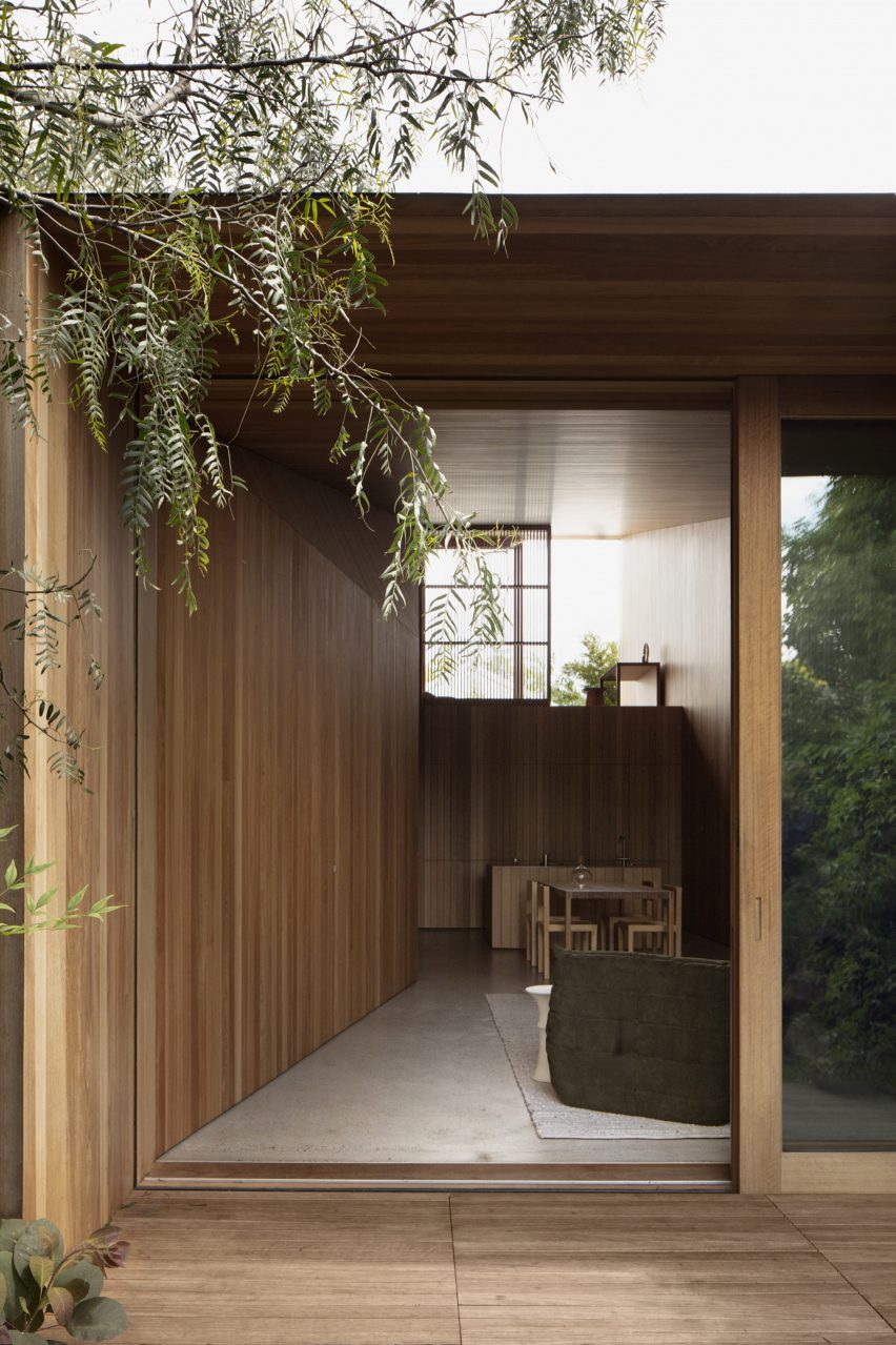 A wood-lined extension offers a seamless transition between the original cottage and the new space.