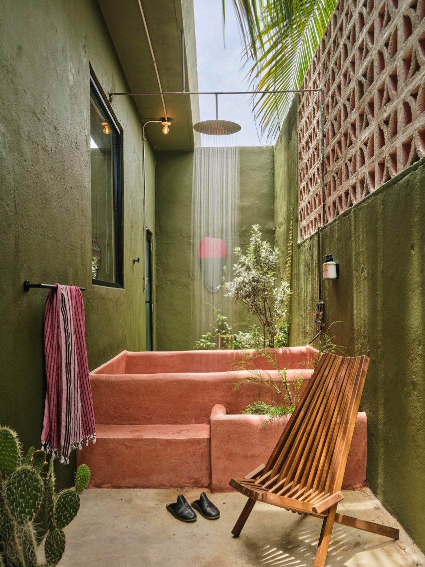Outdoor pink concrete tub and rain shower are part of Verde 2's unique features.