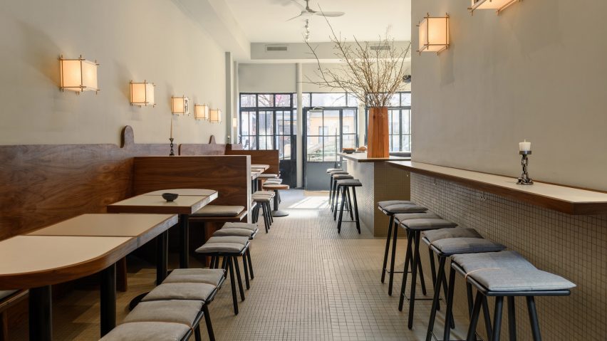 Interior view of With Others wine bar, showcasing taupe walls and a calming atmosphere.