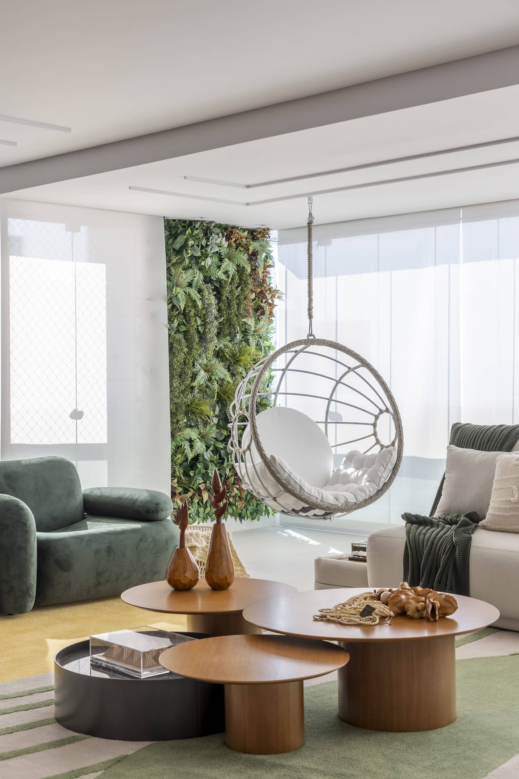 Living room with suspended swing in light tones