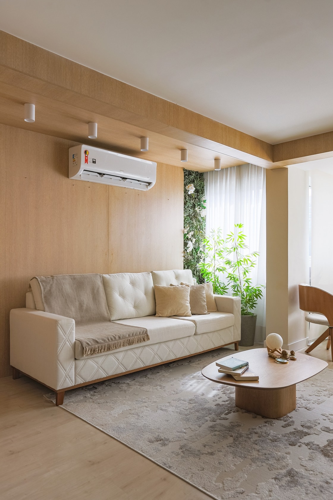 Living room with wood panel for TV