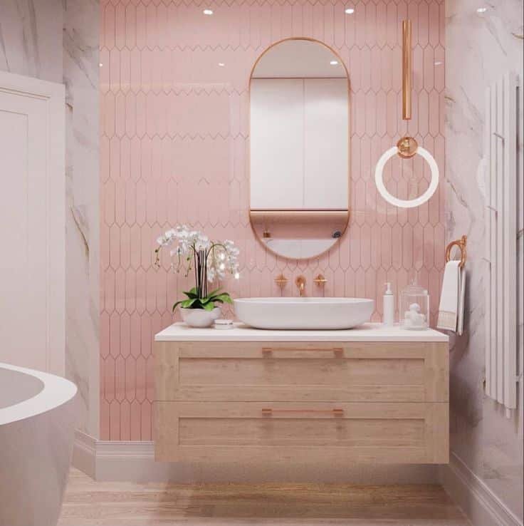 Pink and white bathroom with rose gold highlights