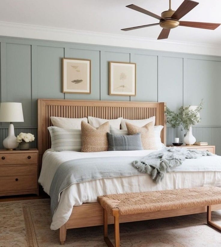 White bedside table with lamp and flower arrangement
