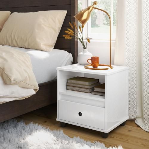 Double bedroom in light colors with headboard and bedside tables with drawers
