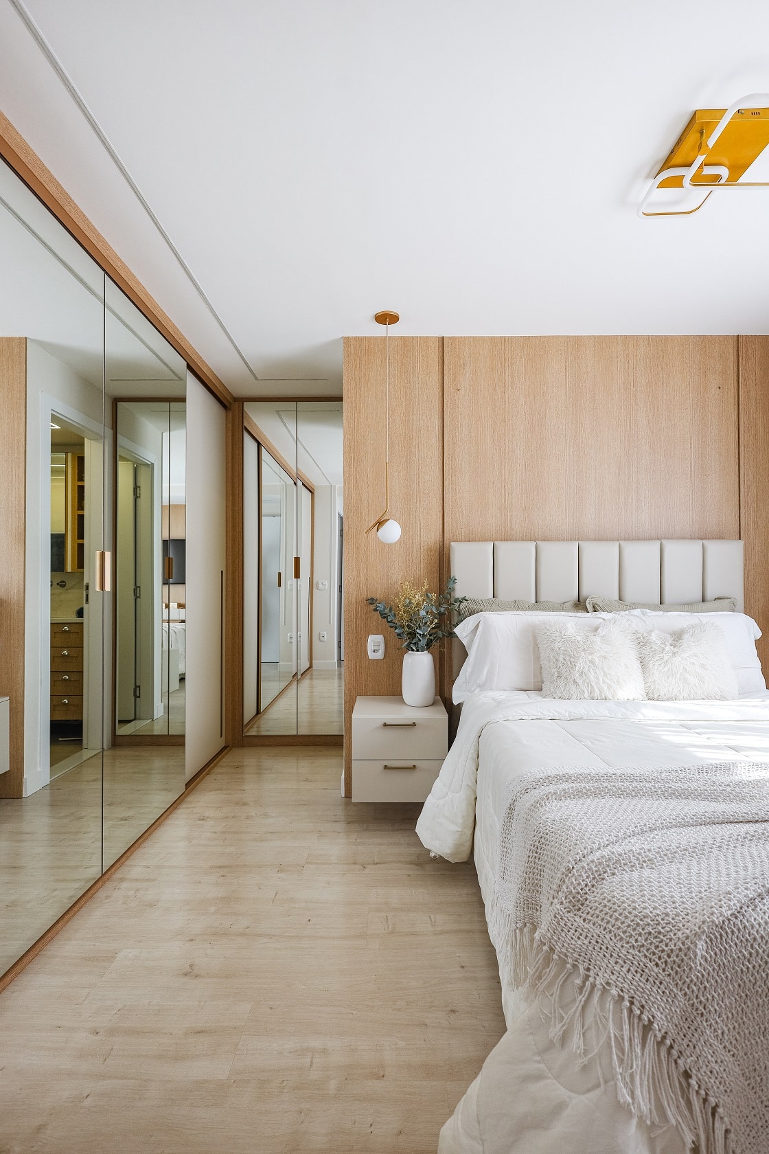 Master bedroom with mirrored wardrobes