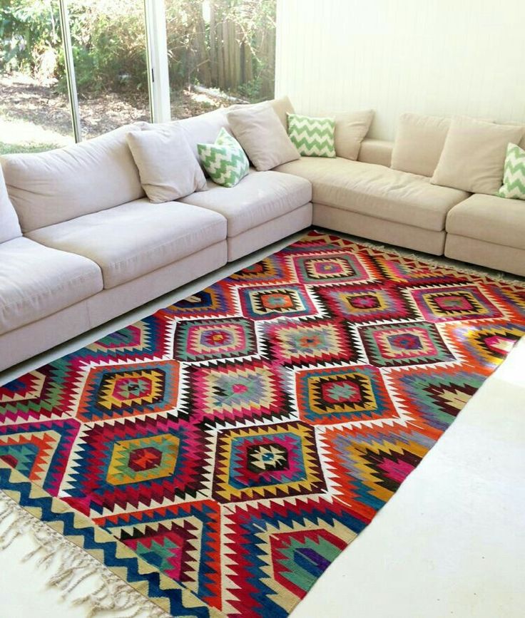 Vibrant Rugs That Transform Your Home Décor Effortlessly. 8 Sofas in light tones with colorful rug