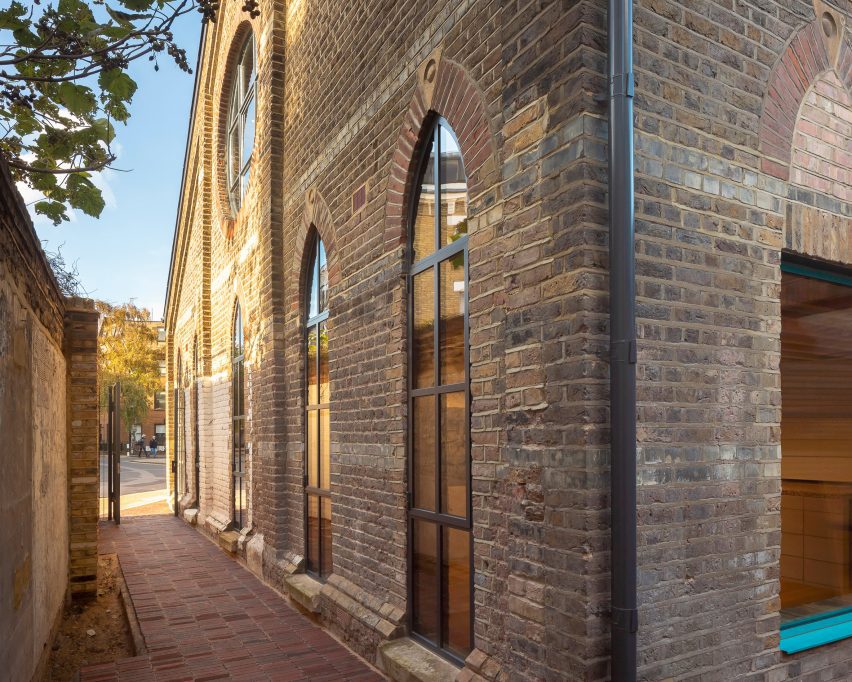 Tigg + Coll Architects Rehabilitate a Victorian Church into Modern Studios 2 Image of original windows that have been restored, highlighting the architecture's historical elements.