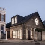 Exterior view of the newly converted studio showcasing its design elements.