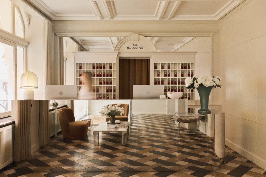 Hotel Bella Grande: A Venetian-Inspired Gem in Copenhagen 4 Bright atrium design featuring marble-tiled floors and colorful furnishings.