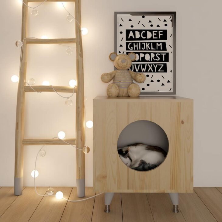 Imagem de uma casinha para gato feita de papelão, em um design simples e charmoso.
