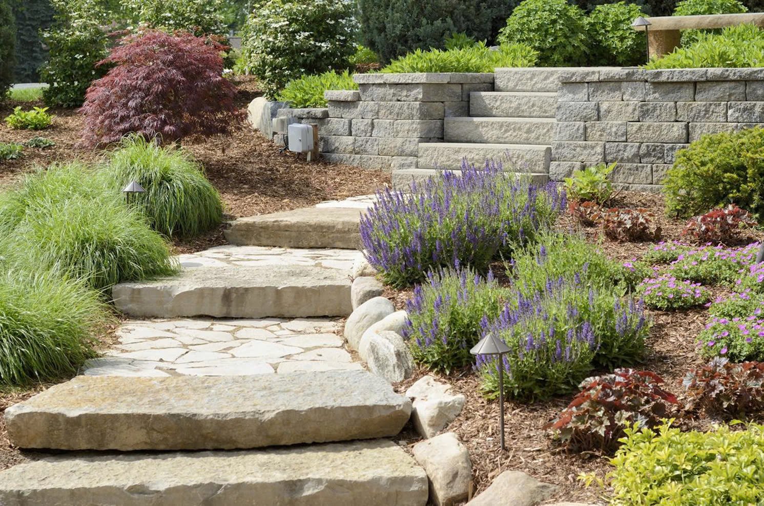 Pavers and stones are excellent choices for enhancing your landscape, offering durability, aesthetic appeal, and versatility.
